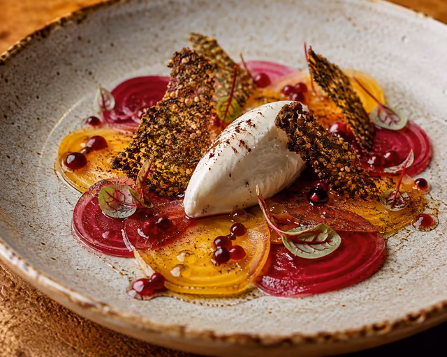 Beet carpaccio with labneh quenelle, pomegranate seeds and sorrel